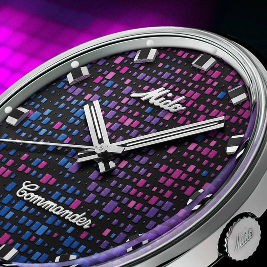 Mido Commander 1959 37mm black automatic steel watch with pink and blue geometric dial on black background