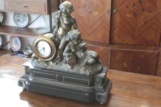 Napoleon III French clock in bronze brass 19th century with two cherub figures on elegant marble