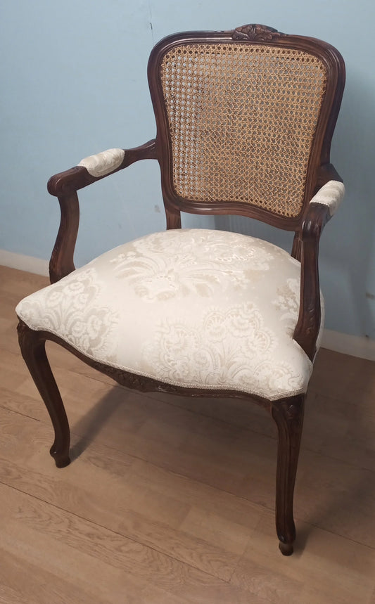 Restored vintage walnut tub chair with woven cannage back and cream upholstered seat