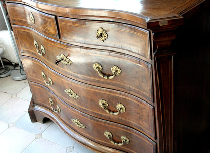 Antique bombe chest of drawers with ornate brass hardware for vintage casa design