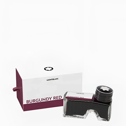 Montblanc boccetta dinchiostro 50ml rosso bordeaux con corpo in vetro trasparente e tappo nero accanto alla confezione brandizzata