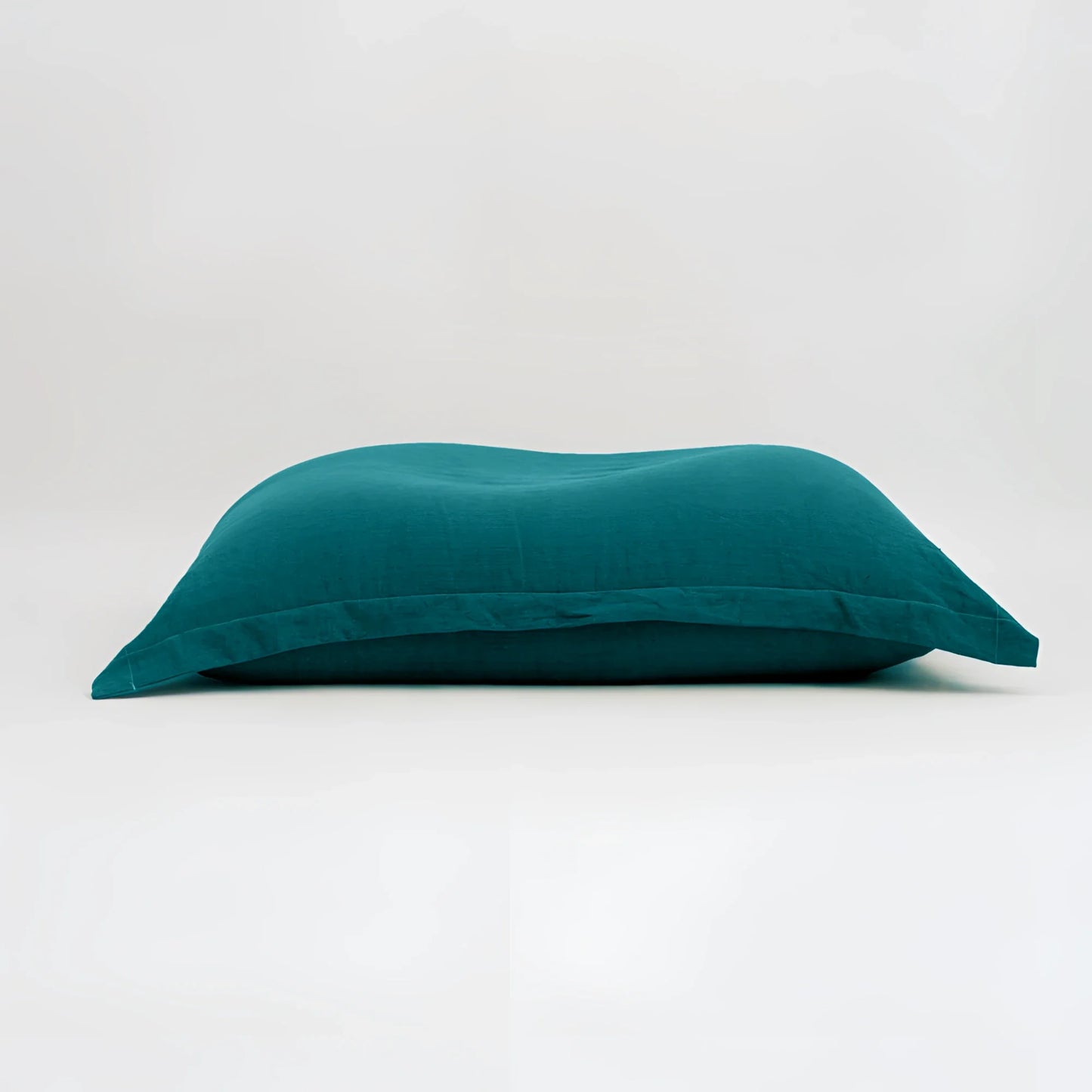 Maxi cuscino firenze teal con tessuto morbido leggermente stropicciato dimensioni generose infinito abbraccio