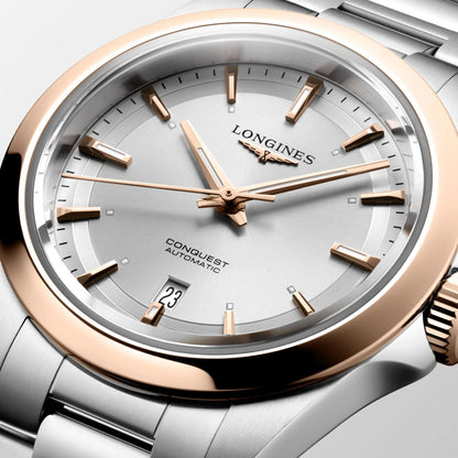 Orologio conquest longines automatico con quadrante argento e dettagli in oro rosa protetto dall’ufficio federale