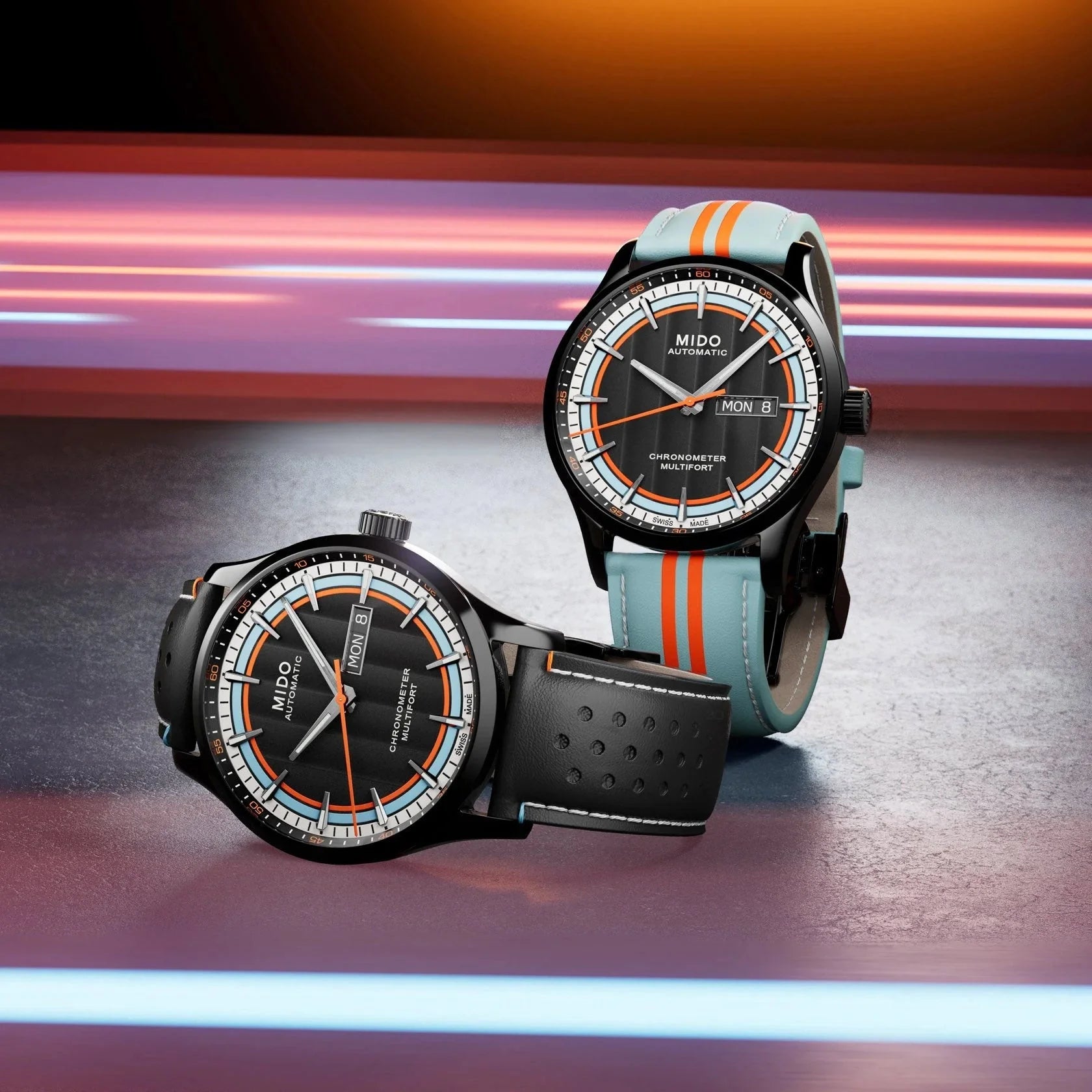 Due orologi mido multifort chronometer automatici con design deciso dell’orologio in acciaio pvd nero e cinturino azzurro arancione