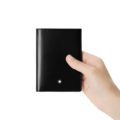 Portafoglio meisterstück montblanc in pelle nera con design elegante e emblema argento sulla parte frontale