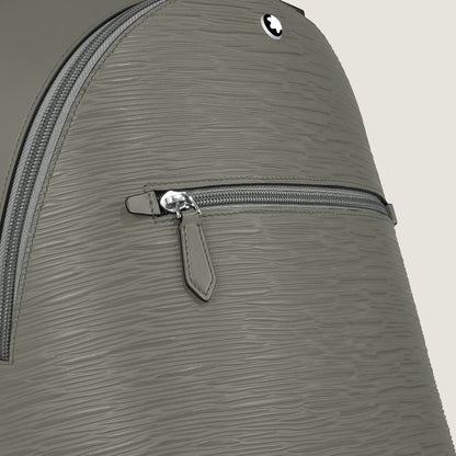 Zaino mini montblanc in pelle grigio medio con cerniera argentata e logo circolare elegante sul davanti